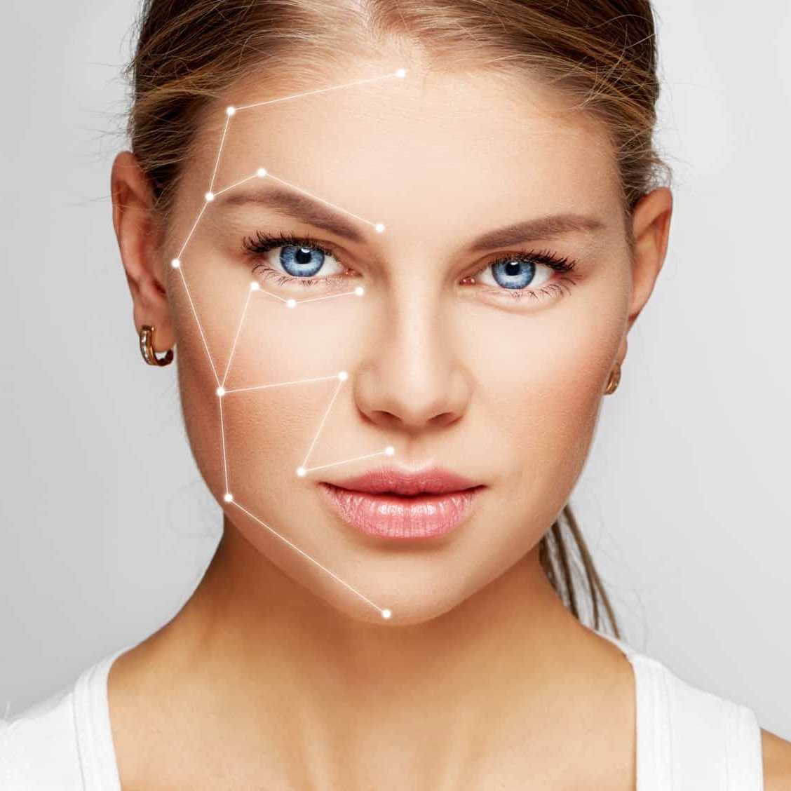 Skin care and technology. Portrait of beautiful woman face with